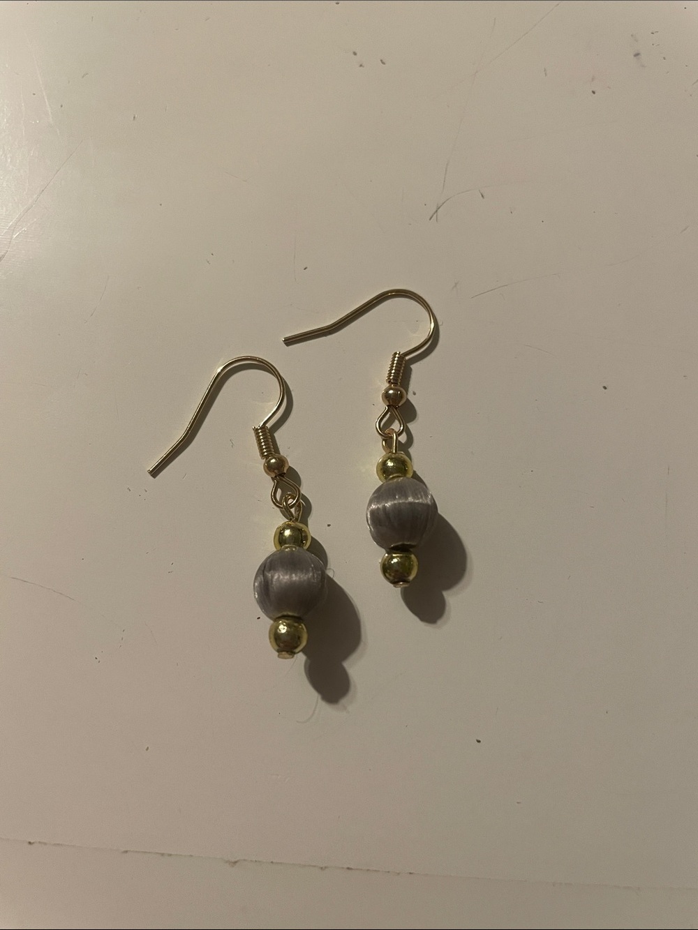 Gold-Tone Hook Earrings with Gray Bead Accent